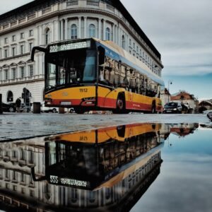 yellow parked bus near building