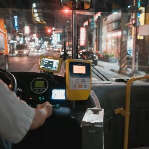 person holding black and yellow digital device